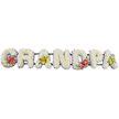 A dignified floral tribute stretches horizontally across the frame, spelling the word "GRANDPA" in bold, solid capital letters that seem designed for display at a funeral or memorial service. Every letter is generously covered with compact white chrysanthemum blooms, their petals overlapping to create a dense, cushion-like surface that suggests softness, purity, and quiet reflection. Along the base of each form, a narrow band of lavender ribbon gently peeks out, outlining the letters with a muted haze of colour and offering a pleasing contrast against both the bright white flowers and the neutral white background. Subtle dark green bars link the letters together, forming a strong backbone that ensures the tribute can be moved or placed with confidence. The design is thoughtfully accented with four floral clusters that add warmth and individuality. On the "G," deep red anthuriums with glossy, heart-shaped spathes and bright spadices sit among rich green leaves, instantly drawing the eye and symbolising deep affection. The first "A" is softened by yellow-green orchids, their delicate, star-like blooms arranged with fresh foliage to create a feeling of grace and living beauty. The "D" carries another spray of red anthuriums, mirroring the left-hand side, while the last "A" repeats the yellow-green orchids to complete the pattern. Together, these flowers form a personalised farewell piece, the kind of bespoke funeral arrangement families in Motspur Park might choose when they want a floral tribute that clearly reads "Grandpa," expressing love, respect, and gratitude in a way words alone rarely can.